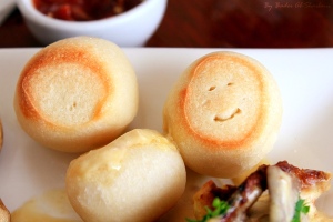 smiling bun on a dinner plate